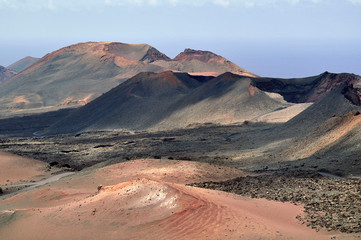 Fototapeta na wymiar Amazing volcanic mountains landscapes of National Park Timanfaya, Lanzarote Canarias 
