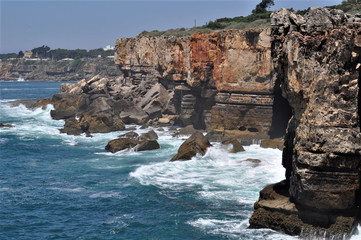 Rocks in the sea. Beautiful Atlantic ocean coastline. Cabo da Roca - the westernmost point in mainland Europe