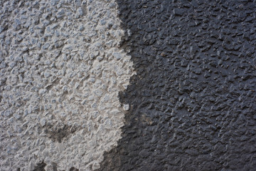 Surface of dry and wet asphalt on top
