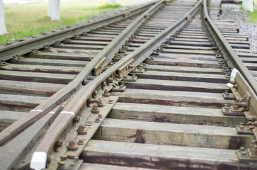 Fototapeta premium Rails and railway sleepers arrow