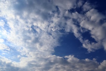 Beautiful white cloud formations in a deep blue sky on a sunny day