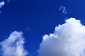 Beautiful white cloud formations in a deep blue sky on a sunny day