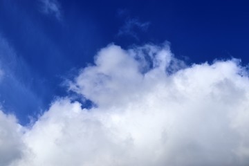 Beautiful white cloud formations in a deep blue sky on a sunny day