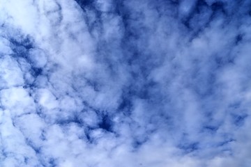 Beautiful white cloud formations in a deep blue sky on a sunny day