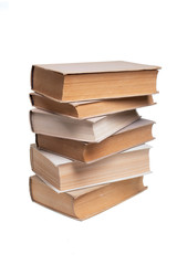 Stack of old books on white background