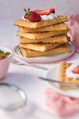 Waffles with strawberries and whipped cream