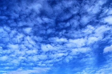 Beautiful white cloud formations in a deep blue sky on a sunny day