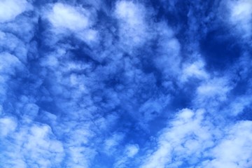 Beautiful white cloud formations in a deep blue sky on a sunny day