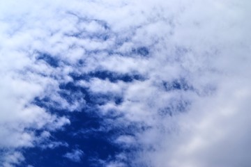 Beautiful white cloud formations in a deep blue sky on a sunny day