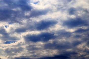 Beautiful white cloud formations in a deep blue sky on a sunny day