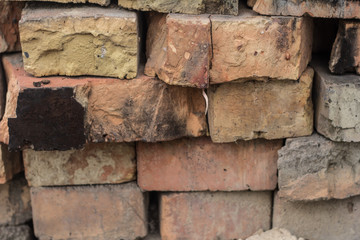 The brick texture, wall, with cracks and scratches can be used as a background