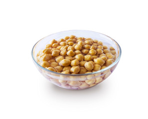 Chickpea soaked in water in a bowl on a white background. Chickpea isolated on white background. Chickpeas soaked in water. Chickpea in a bowl isolated on white.