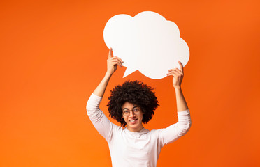 African american man holding blank speech bubble