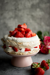 Cake with strawberries. Dark background.
