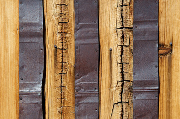 Wood Siding with Tin Cans filling cracks for wall of miners cabin, “Making Due with What You...