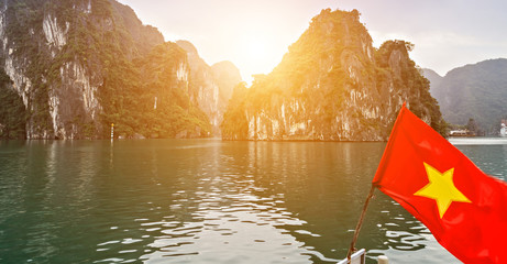 Vietnam Flag rocks Ha Long Bay. Halong Bay Tour Cruise Discover Rocky islands Vietnam