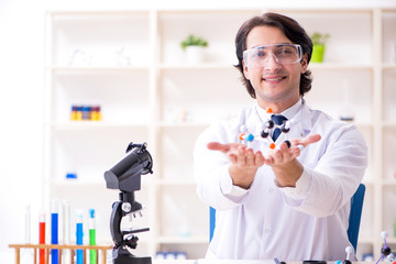 Young male scientist working in the lab 