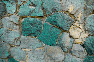 Turquoise stone uneven wall