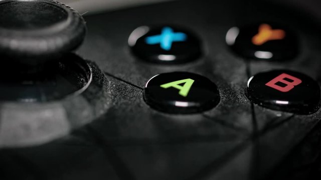 Modern gamepad on a dark. Game controller close-up.