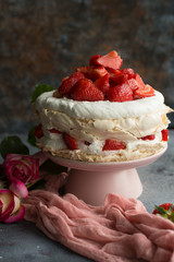 Cake with strawberries. Dark background.