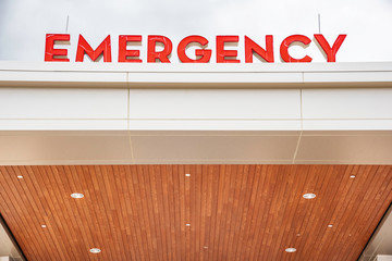 The prominent red emergency letter signs of the hospital's entrance.