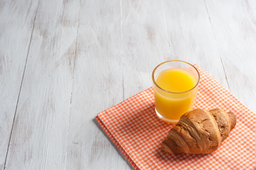 Breakfast with orange juise and croissant