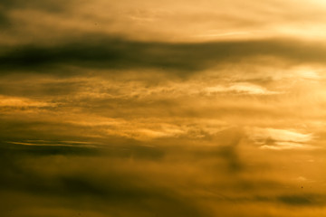 yellow sunset clouds in front of hot sun pattern texture