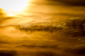 yellow sunset clouds in front of hot sun pattern texture
