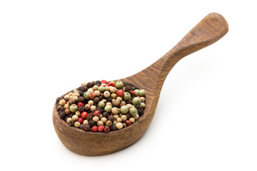 Pepper mix seed on spoon on white background.
