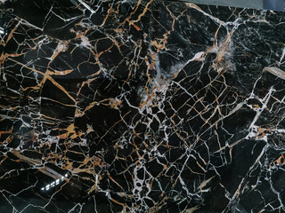 Gold and white Patterned natural of dark gray marble (Gold Russia) texture background for product design