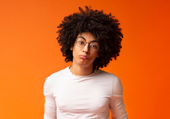 Sad african american guy looking upset and offended