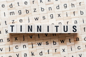 Tinnitus word concept on cubes