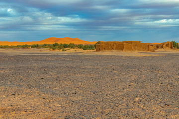 Fototapeta na wymiar Black stoned desert in Merzouga Sahara near Erg Chebbi, Morocco in Africa