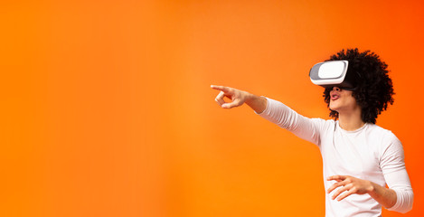 Young african american man experiencing virtual reality