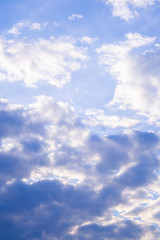 White clouds high in the sky at windy winter day background