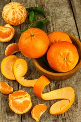 Fresh tangerines on old wooden board. Healthy exotic fruits. Diet food. Tangerine on the table.