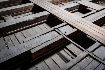 Fototapeta na wymiar old wooden floor beam and plank construction in attic loft -