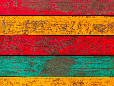 Colored wood fence background painted in red yellow and green color - Powered by Adobe