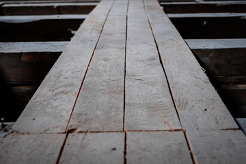 old wooden board floor  or plank construction in attic loft -