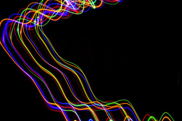 Obraz na płótnie Canvas 3D illustration. Abstract patterns of lights on black background. Lines of colors, luminous strokes.