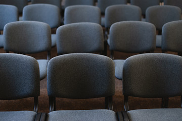 Fototapeta premium Photo of many chairs in handsome audience, at the some event