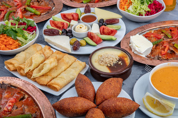 Turkish cuisine; It's also Ramadan 'Iftar'.The meal eaten by Muslims after sunset during Ramadan. Assorted of Turkish oriental dishes. Doner meat in restaurant. - obrazy, fototapety, plakaty