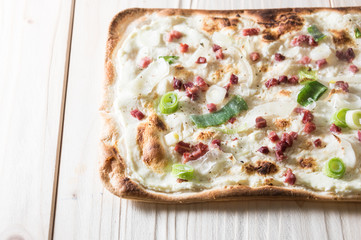 Pizza with bacon and leek onion