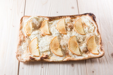 Apple pie on a wooden background