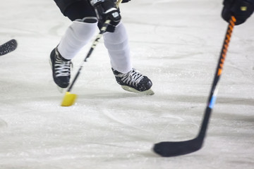 Obraz premium legs during the men Ice Hockey match, sport