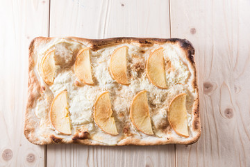 Apple pie on a wooden background