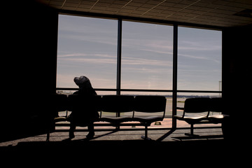 silhouette of man sitting on a bench