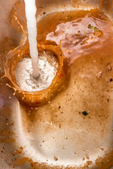 Fresh water being poured into sewage water