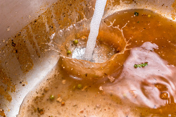 Fresh water being poured into sewage water