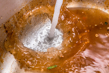 Fresh water being poured into sewage water